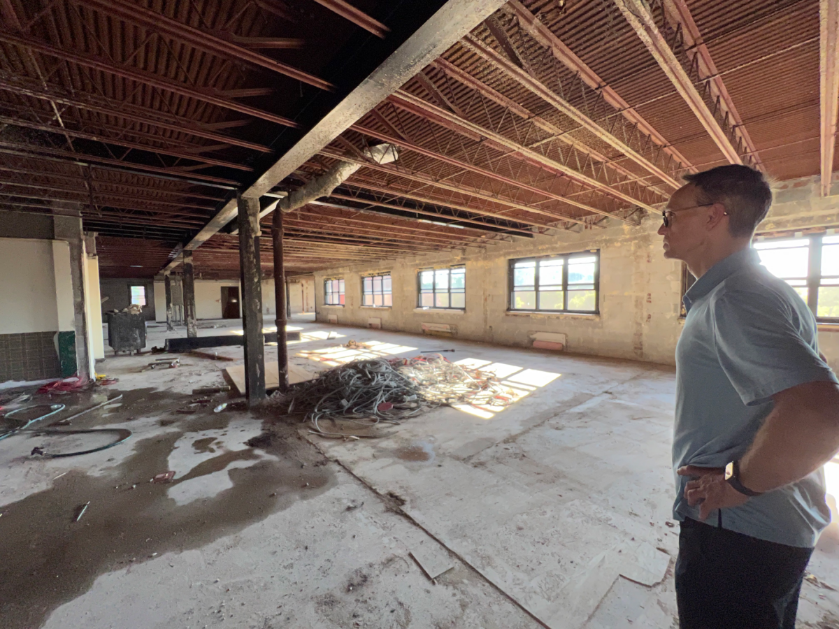 Head of School Charles Fasano surveys progress of interior renovations at Shore Road property.